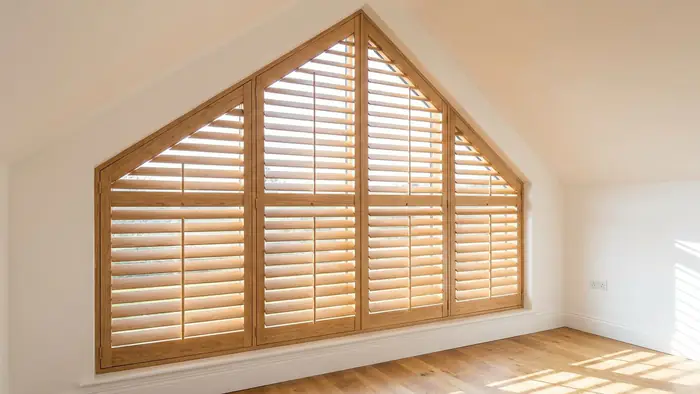 Shutters fitted to a raked window