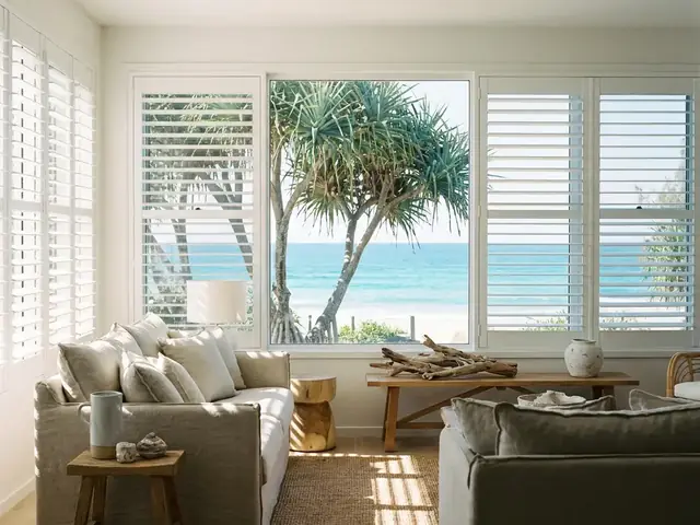 Timber plantation shutters in a coastal living room