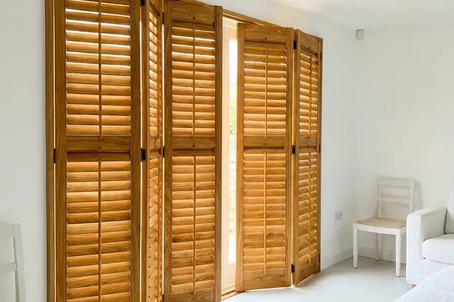 Stained timber plantation shutters with the grain visible through the finish